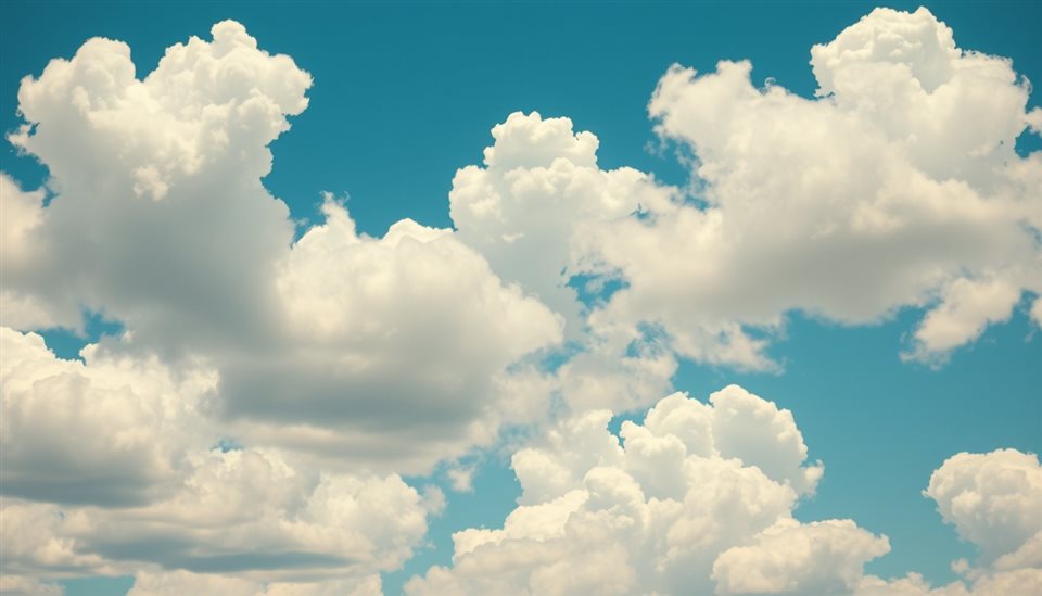 Cinematic film still of Fluffy white cumulus clouds floating across a bright blue summer sky, close-up detail with shallow depth of field, vivid colors, high contrast, energetic, 16:9 aspect ratio