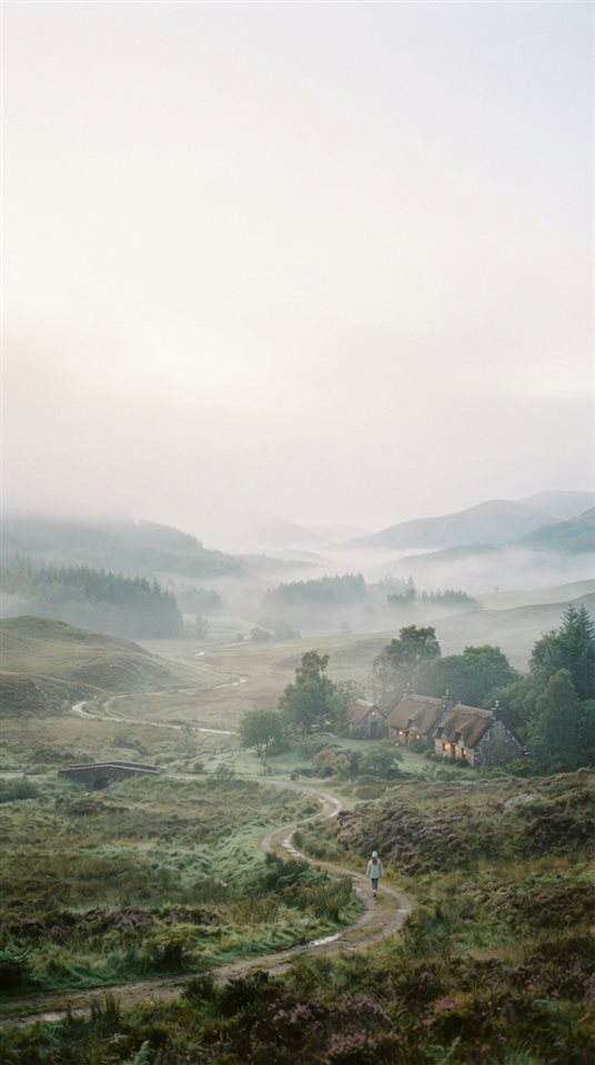 Cinematic film still of foggy landscape, wide shot with open space at the top for text, soft pastel colors, bright and cozy, 9:16 aspect ratio