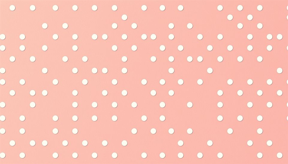 Photorealistic photo of A seamless retro pattern of playful white polka dots evenly spaced on a pastel pink background., centered subject with a simple uncluttered composition, warm golden light, calm mood, 16:9 aspect ratio