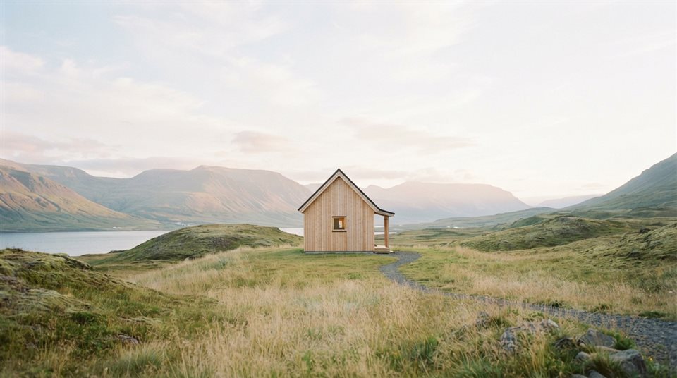 Cinematic film still of calm minimal landscape with plenty of empty space for text, centered subject with a simple uncluttered composition, soft pastel colors, bright and cozy, 16:9 aspect ratio