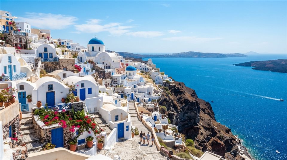 Photorealistic photo of white houses of Santorini above the sea, centered subject with a simple uncluttered composition, vivid colors, high contrast, energetic, 16:9 aspect ratio