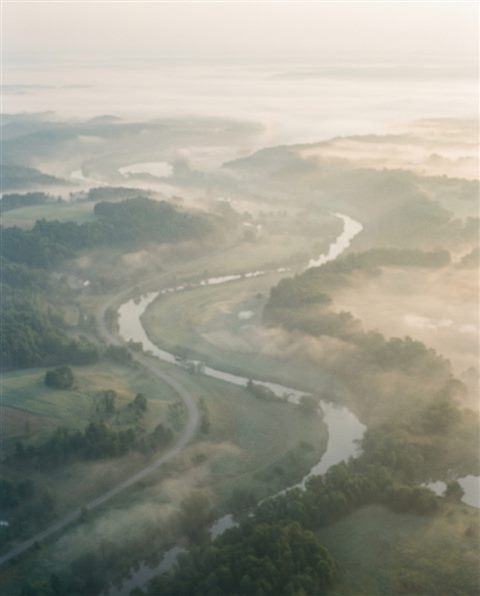 Cinematic film still of soft abstract background, high-angle view from above, misty morning haze, dreamy, 4:5 aspect ratio