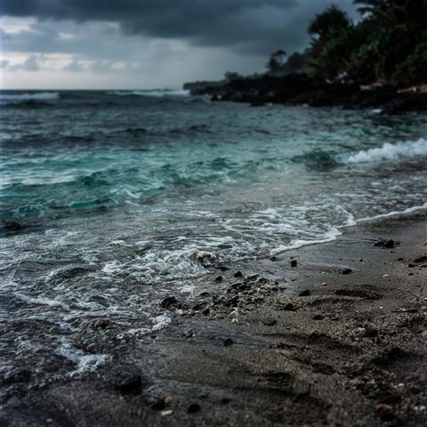 Photorealistic photo of sandy beach with clear turquoise water, close-up detail with shallow depth of field, moody dark tones, dramatic lighting, 1:1 aspect ratio