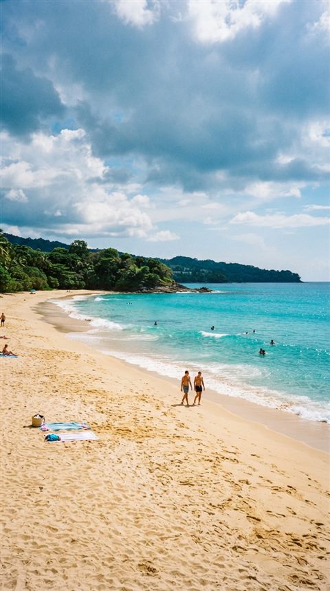 Cinematic film still of sandy beach with clear turquoise water, wide shot with open space at the top for text, vivid colors, high contrast, energetic, 9:16 aspect ratio