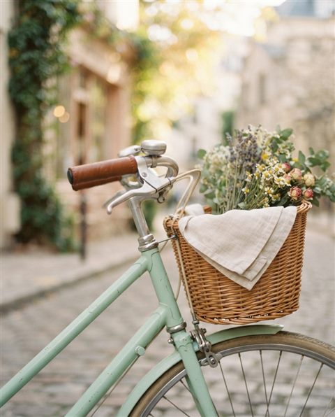 Cinematic film still of bicycle, close-up detail with shallow depth of field, soft pastel colors, bright and cozy, 4:5 aspect ratio