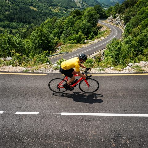 Photorealistic photo of bicycle, high-angle view from above, vivid colors, high contrast, energetic, 1:1 aspect ratio