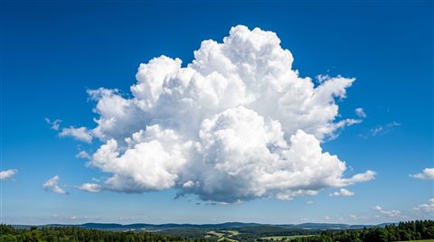 Photorealistic photo of fluffy white clouds, centered subject with a simple uncluttered composition, vivid colors, high contrast, energetic, 16:9 aspect ratio