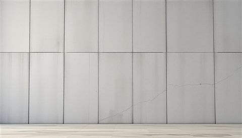 Soft 3D render of A minimalist raw gray concrete wall surface with natural weathering and texture, wide shot with open space at the top for text, misty morning haze, dreamy, 16:9 aspect ratio