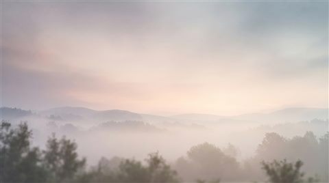 Minimal abstract design of elegant cover background with gentle gradients and empty space for a title, simple balanced layout, misty morning haze, dreamy, 16:9 aspect ratio