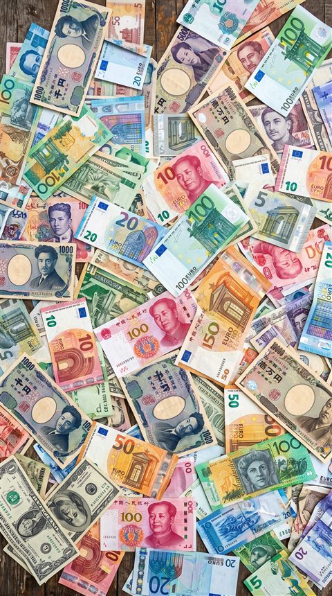 Photorealistic photo of world currency banknotes, high-angle view from above, vivid colors, high contrast, energetic, 9:16 aspect ratio