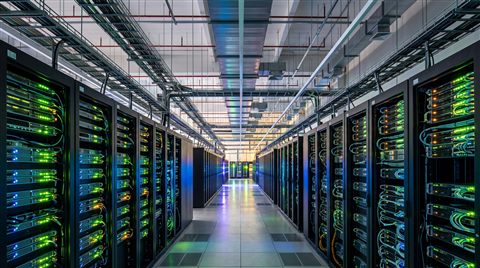 Photorealistic photo of rows of servers in a data center, wide shot with open space at the top for text, vivid colors, high contrast, energetic, 16:9 aspect ratio