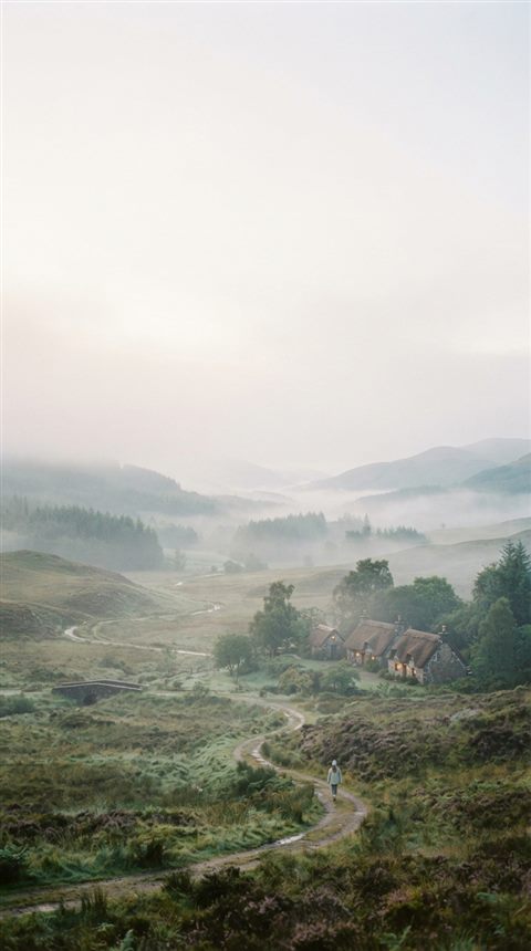 Cinematic film still of foggy landscape, wide shot with open space at the top for text, soft pastel colors, bright and cozy, 9:16 aspect ratio