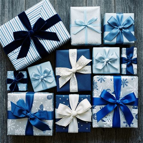 Photorealistic photo of wrapped gift boxes with ribbons, high-angle view from above, cool blue tones, quiet atmosphere, 1:1 aspect ratio