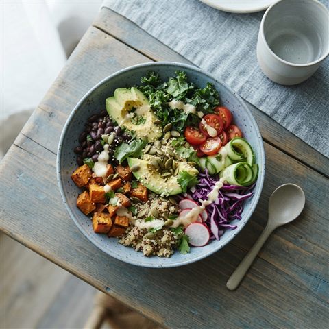 Photorealistic photo of a healthy colorful meal bowl, high-angle view from above, cool blue tones, quiet atmosphere, 1:1 aspect ratio