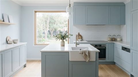 Photorealistic photo of a clean bright kitchen, centered subject with a simple uncluttered composition, cool blue tones, quiet atmosphere, 16:9 aspect ratio