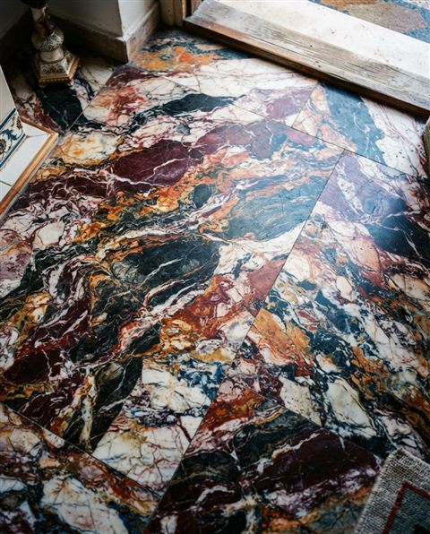 Cinematic film still of marble texture, high-angle view from above, vivid colors, high contrast, energetic, 4:5 aspect ratio
