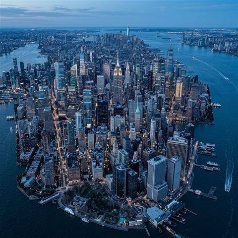 Photorealistic photo of the New York City skyline, high-angle view from above, cool blue tones, quiet atmosphere, 1:1 aspect ratio