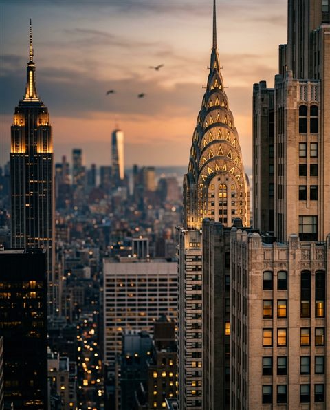 Cinematic film still of the New York City skyline, close-up detail with shallow depth of field, warm golden light, calm mood, 4:5 aspect ratio