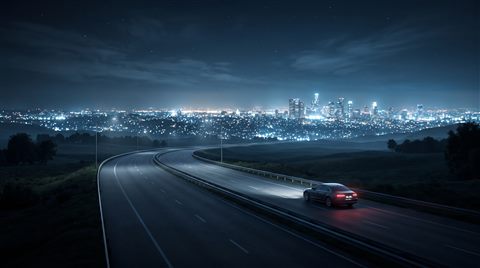 Soft 3d render of car driving on an empty highway at night with city lights, wide shot with open space at the top for text, cool blue tones, quiet atmosphere, 16:9 aspect ratio