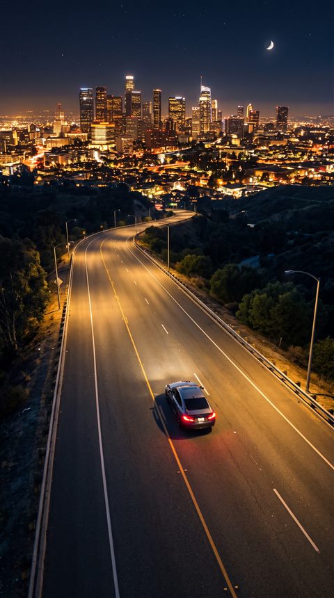Photorealistic photo of car driving on an empty highway at night with city lights, high-angle view from above, warm golden light, calm mood, 9:16 aspect ratio