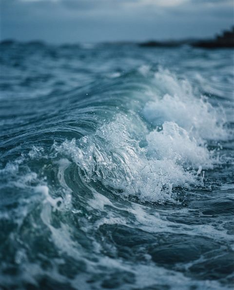 Cinematic film still of ocean waves, close-up detail with shallow depth of field, cool blue tones, quiet atmosphere, 4:5 aspect ratio