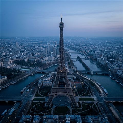 Photorealistic photo of the Eiffel Tower in Paris, high-angle view from above, cool blue tones, quiet atmosphere, 1:1 aspect ratio
