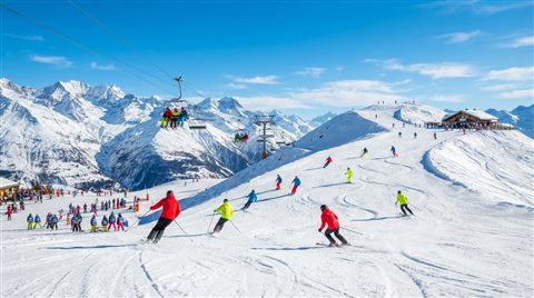 Photorealistic photo of a snowy ski slope, wide shot with open space at the top for text, vivid colors, high contrast, energetic, 16:9 aspect ratio
