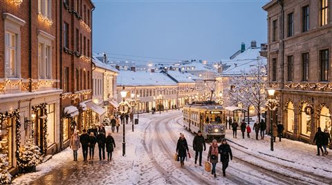Photorealistic photo of snowy city street with holiday lights, wide shot with open space at the top for text, soft pastel colors, bright and cozy, 16:9 aspect ratio