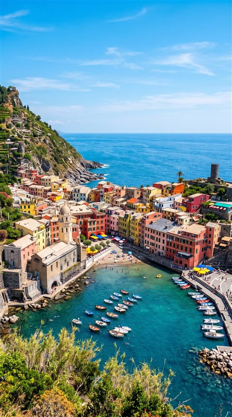 Photorealistic photo of small seaside town under a clear blue summer sky, high-angle view from above, vivid colors, high contrast, energetic, 9:16 aspect ratio