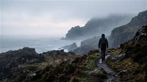 Photorealistic photo of bold dramatic background with empty space on the left half for a person and a title, centered subject with a simple uncluttered composition, misty morning haze, dreamy, 16:9 aspect ratio